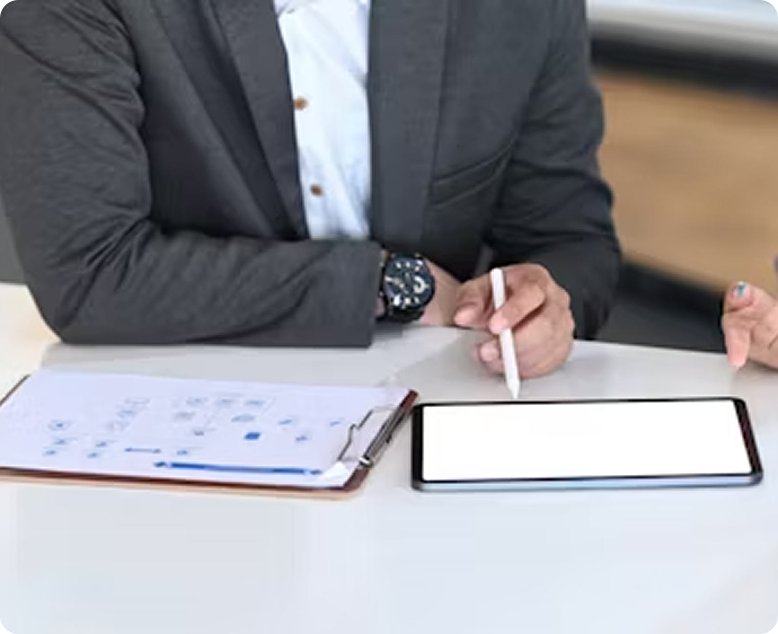 Person in business attire at laptop